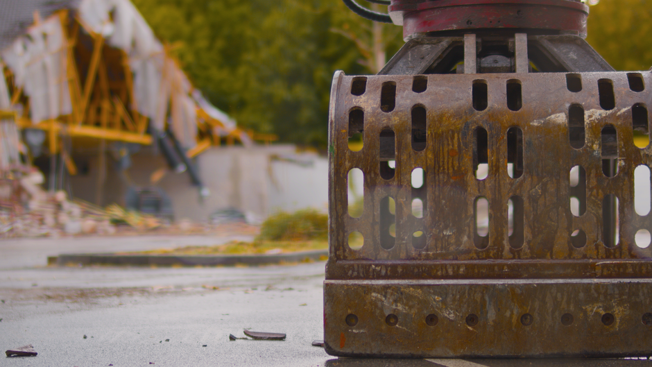 The image displays a large stack of intermodal shipping containers arranged in multiple rows and columns at a freight yard, with some containers exhibiting company logos such as Maersk, China Shipping